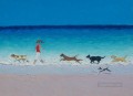 chica con perros corriendo en la playa